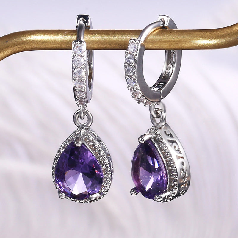Prong set purple gemstone earrings
